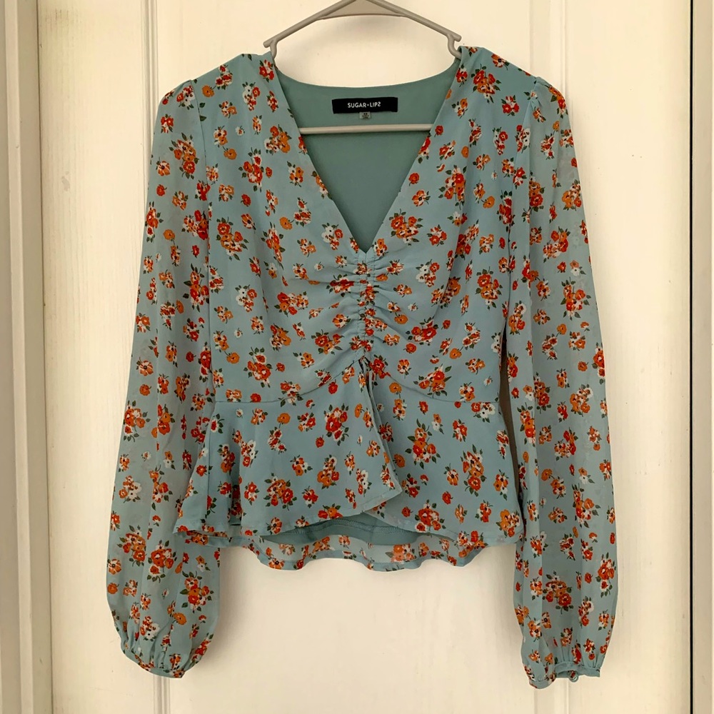 Cinched cropped long sleeve floral blouse